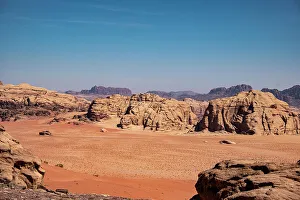 Wadi Rum Prints: Red sand plain and some rocky mountains, Wadi Rum, Jordan, Middle East