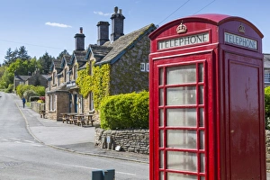 Red telephone box in Beeley Village in springtime, Derbyshire Dales, Derbyshire, England
