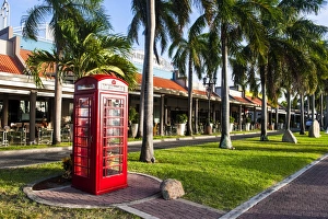 Telephone Box Prints: Red telephone box in downtown Oranjestad