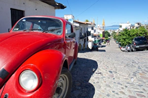Downtown Prints: Red Volkswagen Beetle in residential street