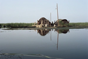 Marshes Prints: Reed houses and boat