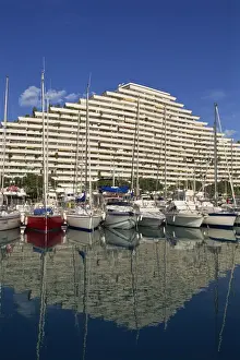 Baie Des Anges Prints: Reflection of boats and modern apartment block in the water of the Marina in the Baie des Anges