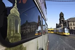 Reflection in bus window, tram on street and Neues Standehaus (New State House)