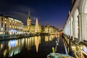 Reflection of Hamburgs Town Hall (Rathaus) and Christmas Market at blue hour, Hamburg