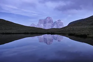 Ponds Prints: Reflection of Pelmo mountain in the Baste lake during blue hour, Dolomites