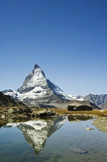 Surface Processes Prints: Reflection in small lake of the Matterhorn