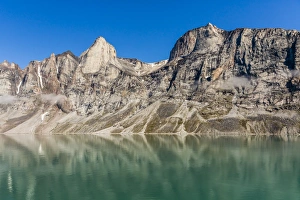 Sea Cliffs Prints: Reflections on a calm sea of the steep cliffs of Icy Arm