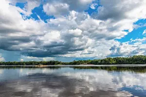 Rainforests Prints: Reflections of clouds in the Casiquiare River in the deep south of Venezuela