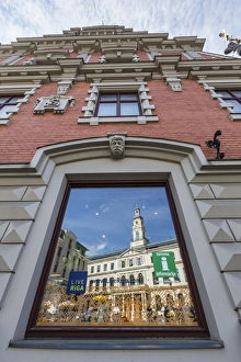 Facades Prints: Reflections of downtown in shop window, Riga, Latvia, Europe