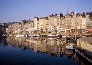 St Catherines Quay Prints: Reflections of houses and boats in the old harbour at St Catherines Quay in Honfleur