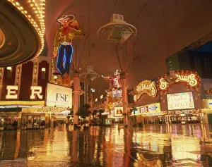 Reflections of neon lights and signs along Fremont Street in Las Vegas