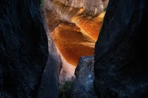Brightness Prints: Reflections of orange light on sandstone walls in Barranco de Luna gorge in Spain create a unique visual experience for