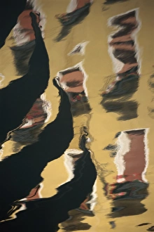 Ripple Prints: Reflections of the prows of gondolas in the water in Venice
