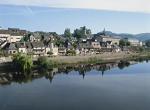 Dordogne Prints: Reflections in the River Dordogne of houses and churches of Argentat in Correze