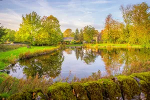 Small Prints: Reflections in village pond in Monyash village during autumn in Bakewell