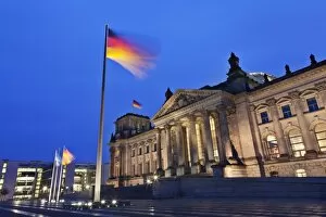 Images Dated 27th February 2009: Reichstag and German flags at night, Mitte, Berlin, Germany, Europe