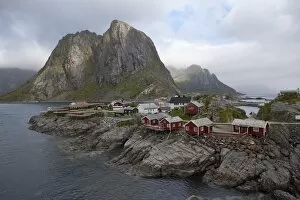 Images Dated 13th June 2010: Reine village with typical red rorbuer and cod drying flakes, Moskenesoy island