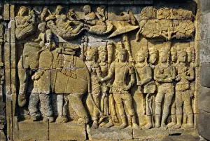 Relief carvings on frieze on outside wall of the Buddhist temple