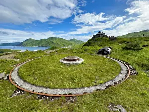 Dutch Prints: Remains of World War II gun emplacement found in Dutch Harbor Unalaska Alaska with visitors nearby