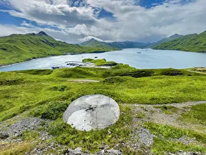 Dutch Prints: Remains of a World War II gun emplacement in a remote location near a body of water in Alaska