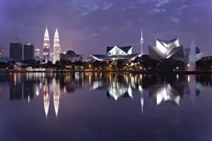 Images Dated 30th December 2011: The remarkable Kuala Lumpur skyline, reflected in a lake at Titiwangsa in Kuala Lumpur, Malaysia