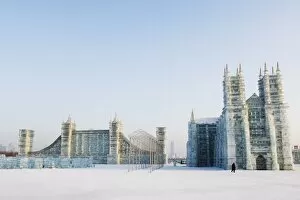 Replica ice sculptures of Notre Dame Cathedral and Londons Tower Bridge at the Ice Lantern Festival, Harbin