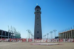 Roads Prints: Replica of an old watchtower stands tall against the blue sky in Magas