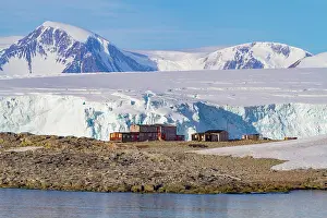 Antarctic Prints: Research base on Stonington Island offers views of ice and mountains in Antarctica during a clear day