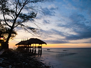 Indonesia Prints: Restaurant on the beach at sunset