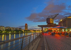 Cobbled Prints: Restaurant beneath old dockyard crane by River Main, Frankfurt-am-Main, Hesse, Germany