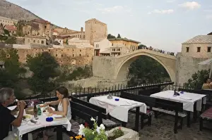Herzegovina Prints: Restaurant overlooking the Stari Most Peace Bridge on Neretva River, Mostar