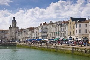 Restaurants lining the edge of the marina in the ancient port of La Rochelle