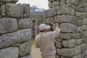 Restoration work at the Inca ruins of Machu Picchu, UNESCO World Heritage Site, Peru