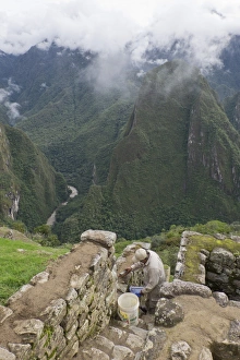 Uniform Prints: Restoration work at the Inca ruins of Machu Picchu, UNESCO World Heritage Site, Peru