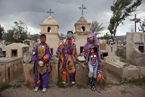 Costumes Prints: Revellers in costumes and masks at a cemetery in Humahuaca during carnival in Jujuy