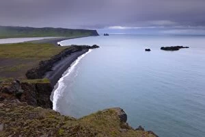 Images Dated 7th July 2009: Reynisfjara black sand beach and Reynisdrangar sea stacks in the distance