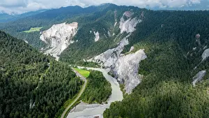 Erosion Prints: Rhein gorge shows winding river and steep cliffs with green forest in Switzerland