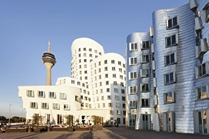 Rheinturm tower and Gehry Haus building, Medienhafen, Dusseldorf, North Rhine-Westphalia, Germany, Europe