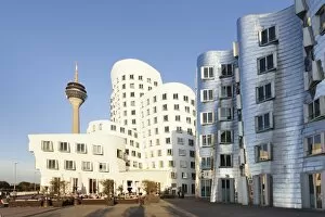Typically German Gallery: Rheinturm tower and Gehry Haus building, Medienhafen, Dusseldorf, North Rhine-Westphalia, Germany