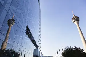 Dusseldorf Prints: Rheinturm tower reflecting in the facade of Stadttor building