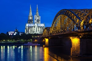 Stereotypically German Prints: Rhine bridge and Cathedral of Cologne above the River Rhine at night