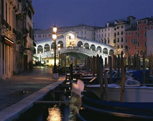 The Rialto Bridge illuminated at night in Venice, UNESCO World Heritage Site The Rialto Bridge illuminated at night in Venice, UNESCO World Heritage Site