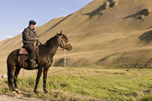 Young Man Prints: Rider with his horse in wilderness, Song Kol, Kyrgyzstan, Central Asia, Asia