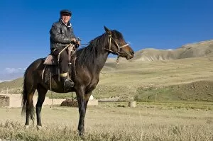 Images Dated 30th August 2009: Rider with his horse in wilderness, Song Kol, Kyrgyzstan, Central Asia, Asia
