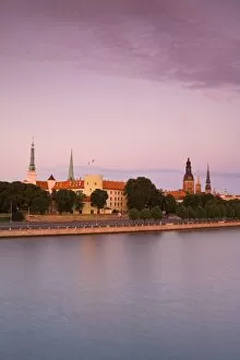 Riga Castle and the River Daugava illuminated at sunset, Riga, Latvia, Europe