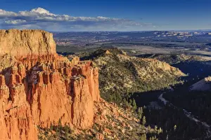 Hoodoo Prints: Rim cliffs and hoodoos lit by late afternoon sun with distant view in winter