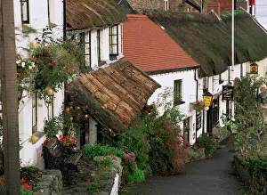 Cottage Prints: The Rising Sun hotel and thatched buildings, Lynmouth, Devon, England, United Kingdom