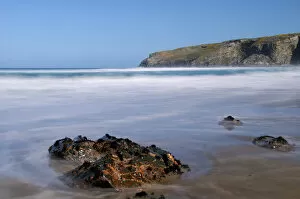 Images Dated 8th April 2009: A rising tide swirls around a rock on the beach at Trebarwith Strand, Cornwall, England