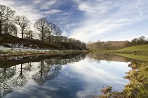 Ambleside Prints: River Brathay on a calm winters day with reflections of trees and distant fells