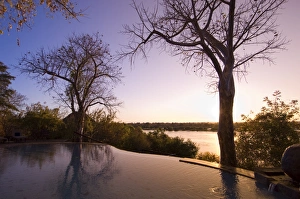 Swimming Pools Prints: The River Club lodge, sunset on Zambesi River, Zambia, Africa